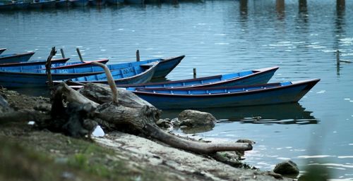 Abandoned boat moored in sea