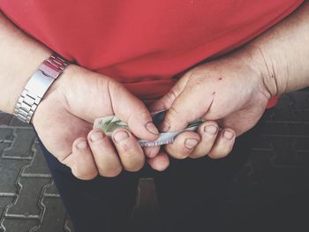 Close-up of man holding hands