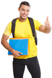 Portrait of a smiling young man standing against white background