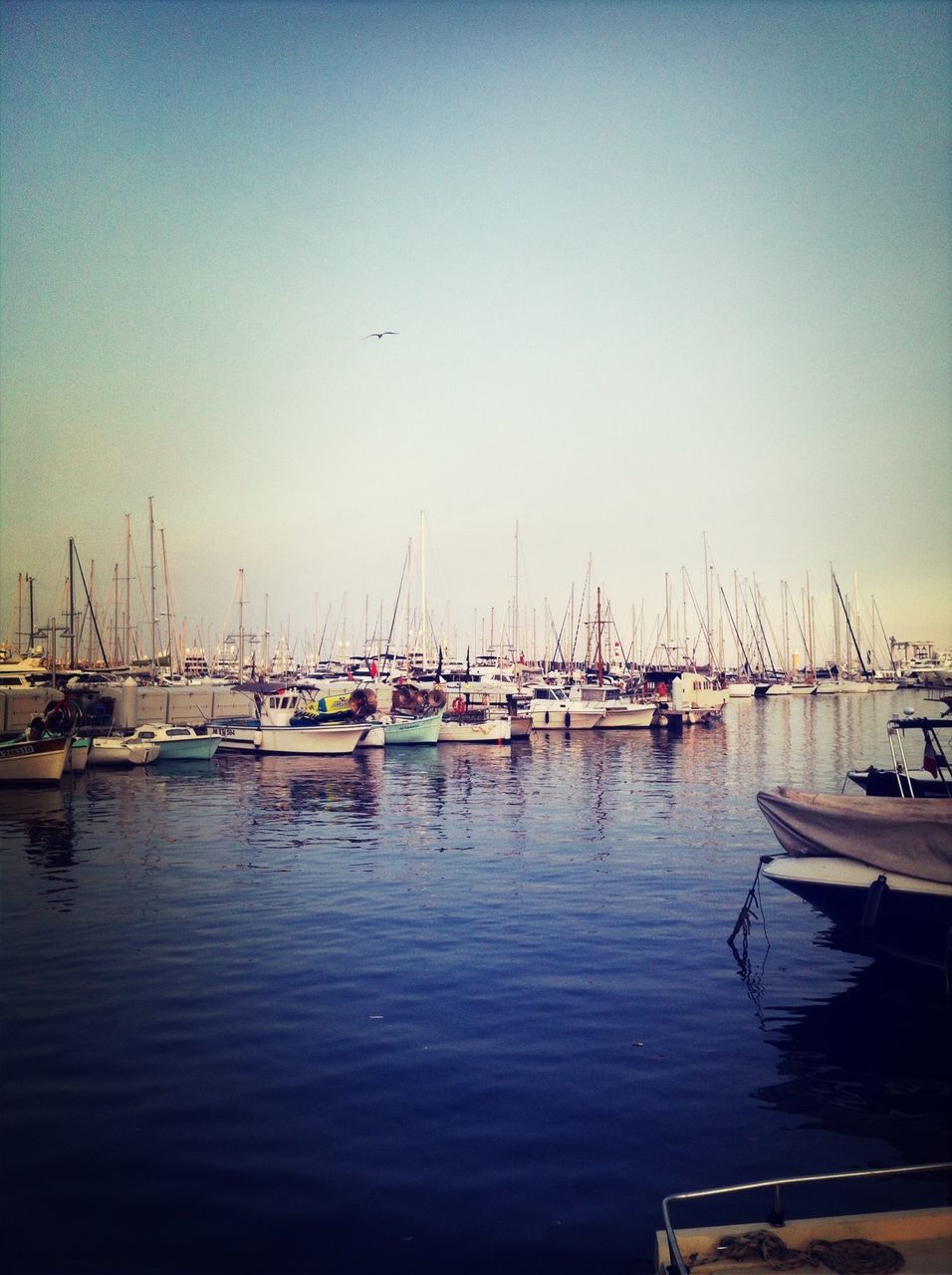 nautical vessel, transportation, mode of transport, boat, moored, water, clear sky, mast, harbor, sea, sailboat, waterfront, copy space, reflection, tranquil scene, nature, tranquility, outdoors, sky, no people