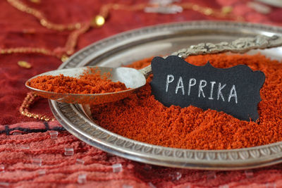 Close-up of paprika powder in plate on table