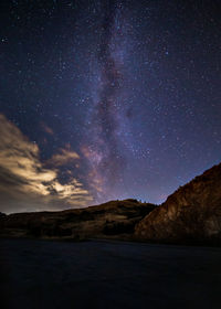 Scenic view of star field against sky at night