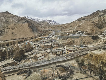 High angle view of text on mountain against sky