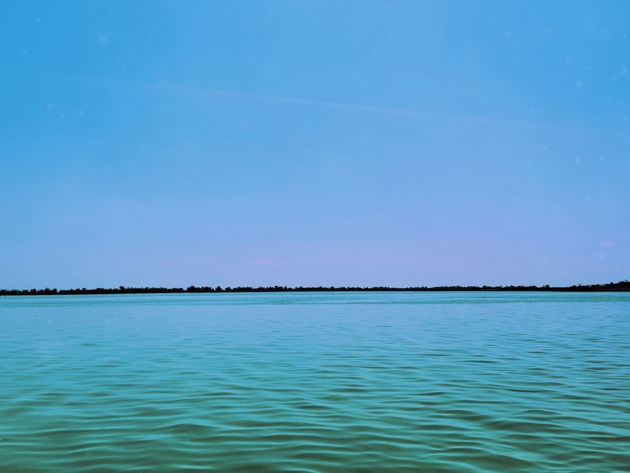 SCENIC VIEW OF BLUE SEA AGAINST CLEAR SKY