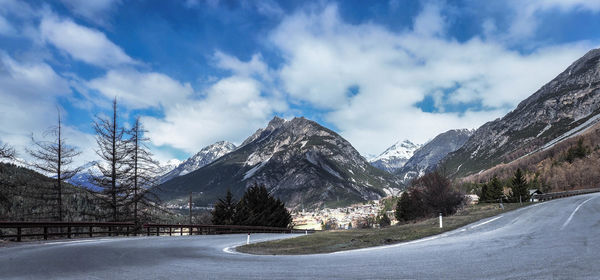 Panoramic view of snowcapped mountains against sky
