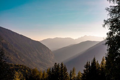 Scenic view of silhouette mountains against sky during sunset