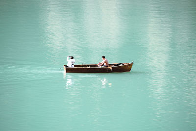 High angle view of people in boat on lake