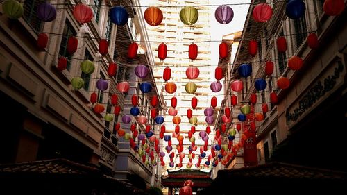 Low angle view of lanterns hanging on building