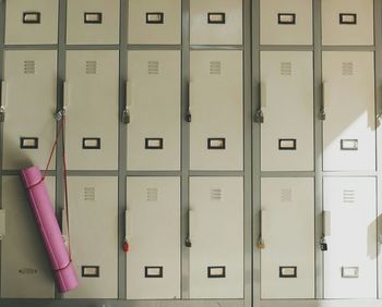 Pink mat hanging on lockers