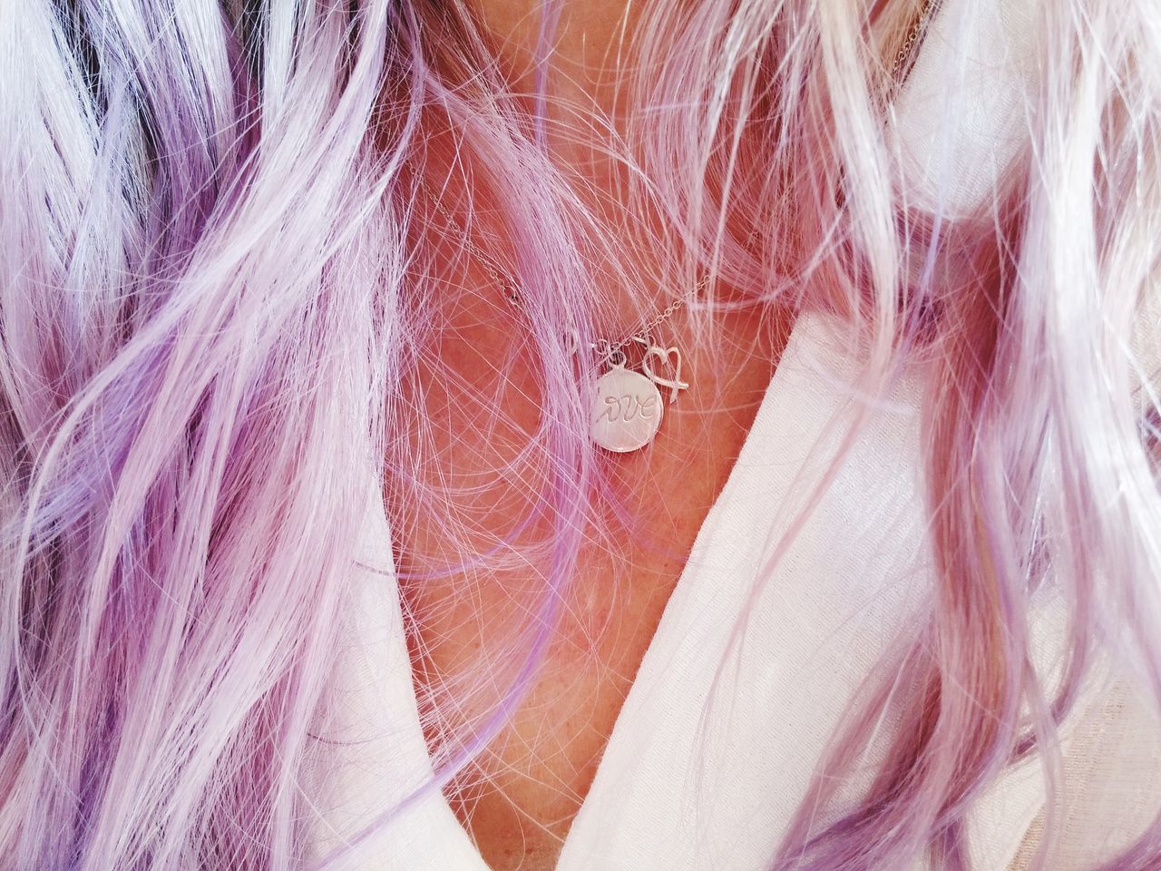 EXTREME CLOSE-UP OF WOMAN WITH PURPLE HAIR