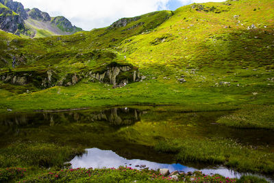 Scenic view of lake by mountains