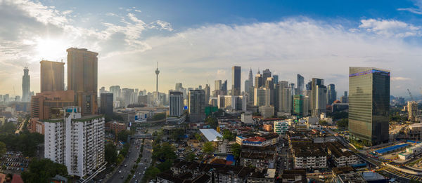 Aerial view of modern buildings in city against sky