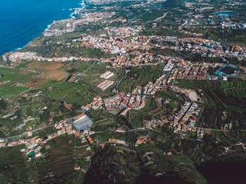 High angle view of townscape by sea