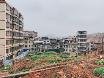 Buildings in city against sky
