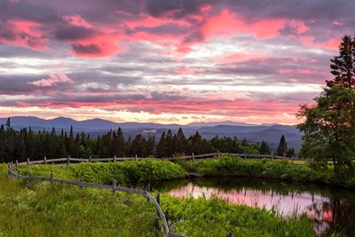 Scenic view of field against sky during sunset