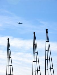 Low angle view of airplane flying in sky
