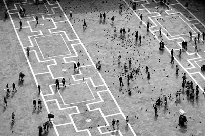 High angle view of people walking on road