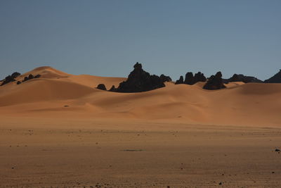 Scenicof desert against clear sky acacus mountains, libya