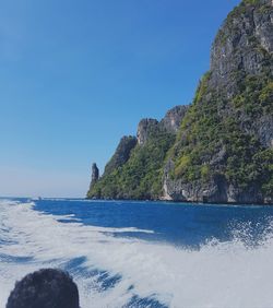 White foam and splashing water from the back of speedboat