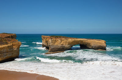 Scenic view of sea against clear blue sky