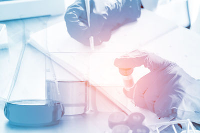 Cropped hands of scientist experimenting in laboratory