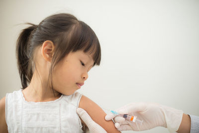 Close-up of girl holding hands