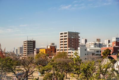 View of buildings in city against sky