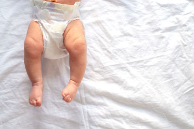 Low section of man on bed