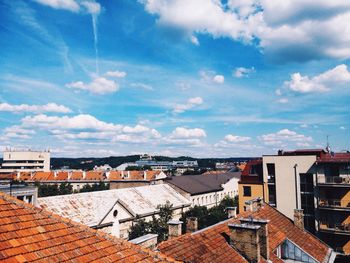 Residential buildings against cloudy sky