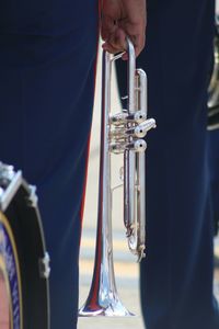 Close-up of cropped hand holding cigarette