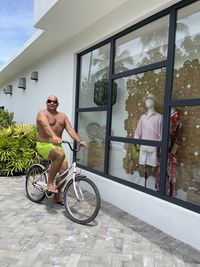 Man riding bicycle on glass window