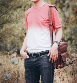 Midsection of man standing by plants