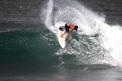 High angle view of man surfing in sea