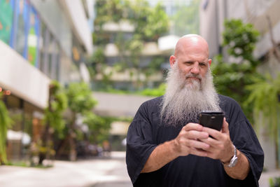 Man using mobile phone outdoors