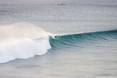 People surfing in sea