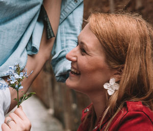 Portrait of young woman holding flower