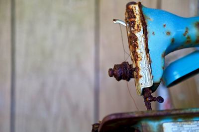 Close-up of rusty metal against wall