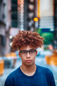 Portrait of young man in city