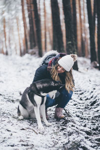 Dog on snow covered land