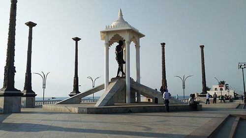 Tourists at entrance of historical building