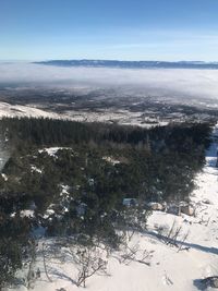 Scenic view of landscape against sky during winter