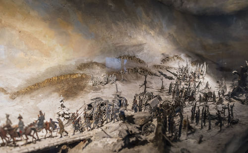 High angle view of people on rocks at shore