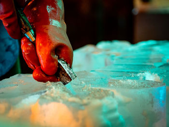 Close-up of hand holding red wine