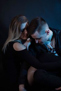 Close-up of young couple sitting