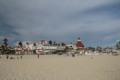 View of beach against cloudy sky