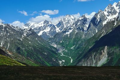 Scenic view of snowcapped mountains against sky