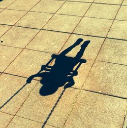 Shadow of people on tiled floor