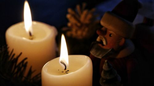 Close-up of illuminated candle