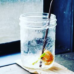 Close-up of drink in glass jar on table