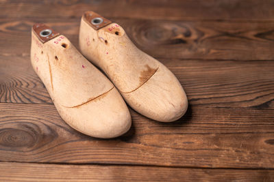 High angle view of shoes on wooden table